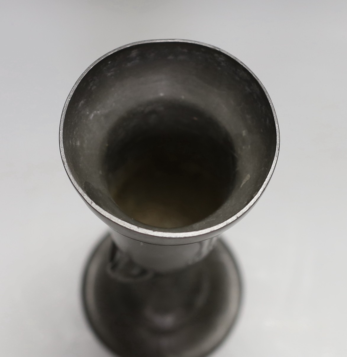 An Art Nouveau pewter vase with glass inset cabochon, 23cm